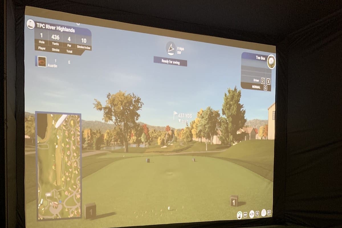 Uneekor QED simulator bay at GolfX 24-hour indoor golf in Franklin, Massachusetts