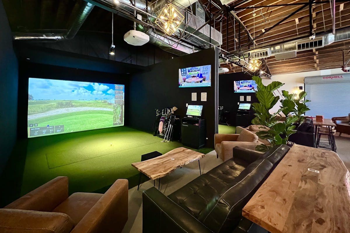 Trackman simulator bay and cocktail lounge at One Shot Back on Curtis Street, downtown Denver