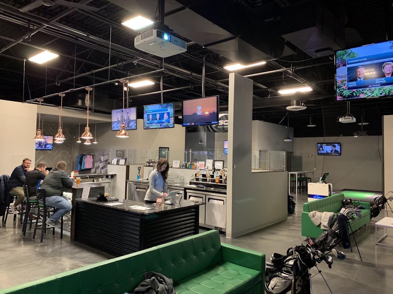 X-Golf Grand Rapids indoor golf simulator bays on 28th Street SE