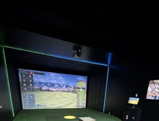 Simulator bay showing a mountain course at Hive Golf in Bountiful, UT