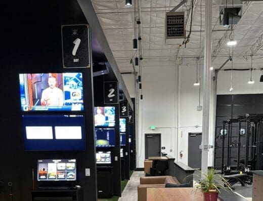 Check-in kiosks, gym and lounge at Tee Box Meridian in Meridian, ID