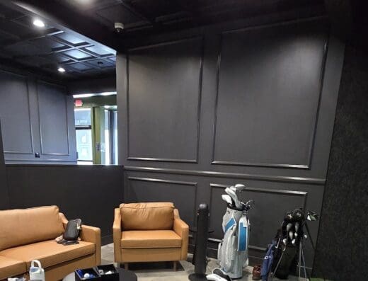 Couch, clubs and putting area at The Back Nine Golf in Poway, CA